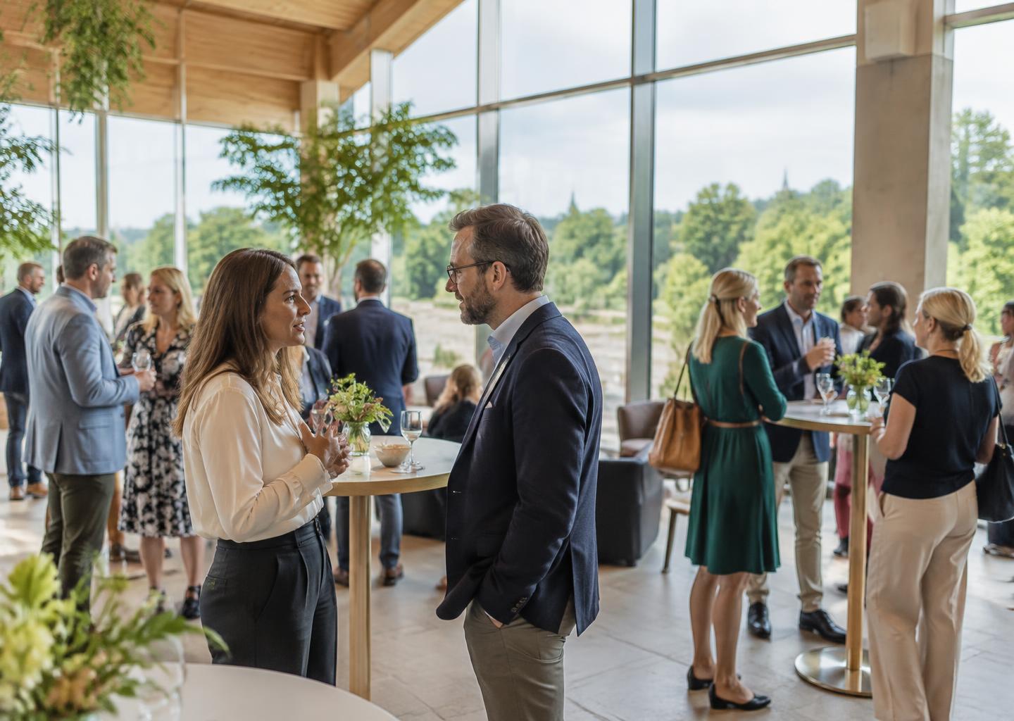 Illustrative corporate networking gathering in a light-filled venue